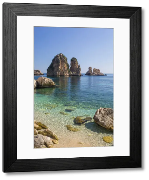 Framed Print : View across tranquil cove to the Faraglioni, a series of towering offshore rock stacks Framed Print : View across tranquil cove to the Faraglioni, a series of towering offshore rock stacks