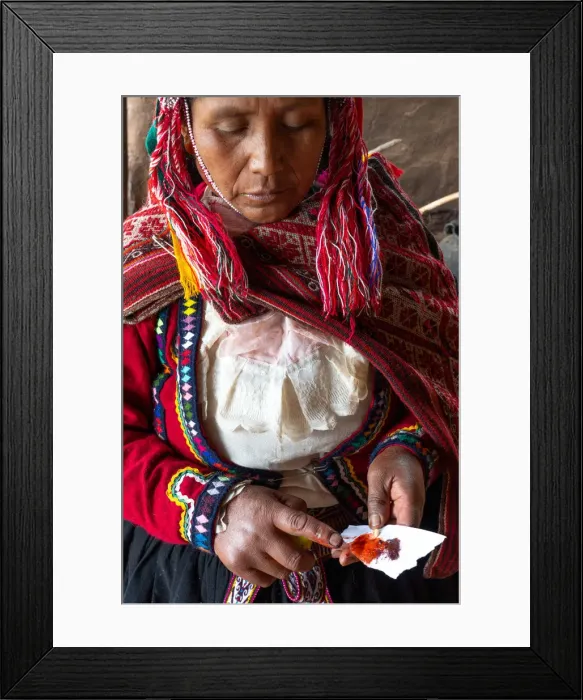 Framed Print : Local female weaver mixing cochineal dye from insects, the definitive red used, Chumbe