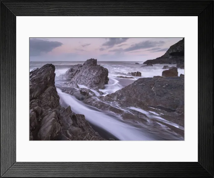 Framed Print : Waves surge around the jagged rocks on Wildersmouth Beach, Ilfracombe, Devon, England Framed Print : Waves surge around the jagged rocks on Wildersmouth Beach, Ilfracombe, Devon, England