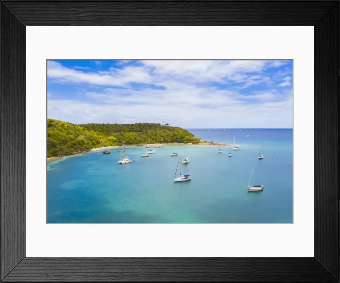 Framed Print : Sailboats and catamarans moored in a tropical bay, aerial view by drone, Caribbean Sea Framed Print : Sailboats and catamarans moored in a tropical bay, aerial view by drone, Caribbean Sea