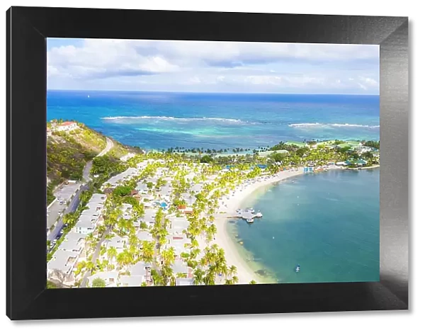 Aerial panoramicby drone of palm-fringed beach, St. James Bay, Antigua, Leeward Islands