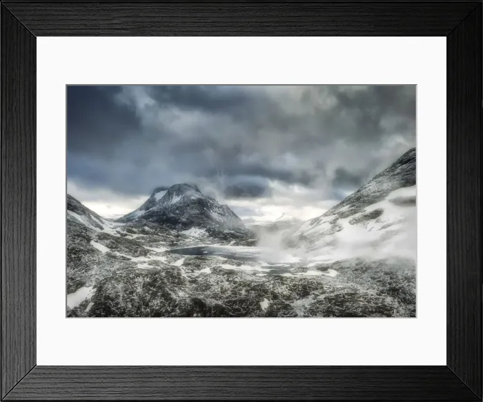 Framed Print : Storm clouds over Olaskarsvatnet lake at feet of the snowcapped Olaskarstind mountain Framed Print : Storm clouds over Olaskarsvatnet lake at feet of the snowcapped Olaskarstind mountain