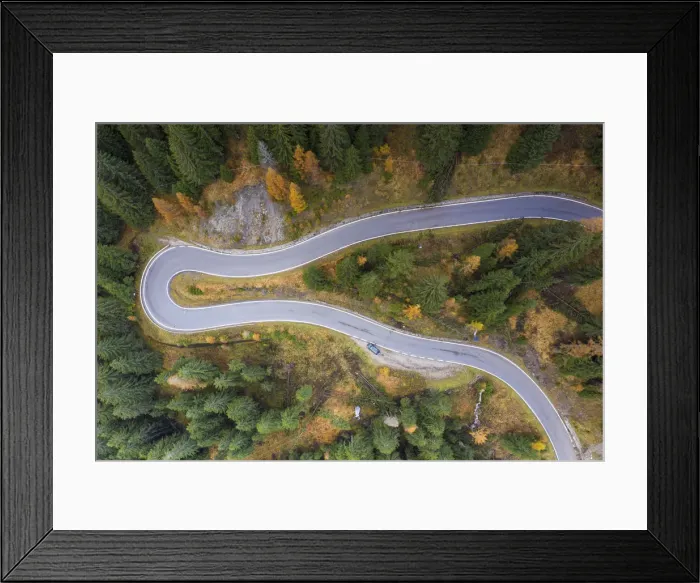 Framed Print : A view by drone of a winding road in the Dolomites, Veneto, Italy, Europe Framed Print : A view by drone of a winding road in the Dolomites, Veneto, Italy, Europe