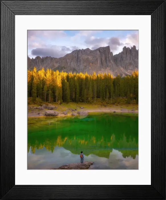 Framed Print : Young man observing the beauty of Lago Di Carezza at sunset, Dolomites, Italy, Europe Framed Print : Young man observing the beauty of Lago Di Carezza at sunset, Dolomites, Italy, Europe