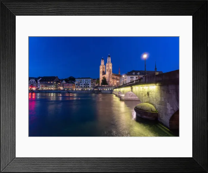 Framed Print : Illuminated buildings of Limmatquai and Grossmunster at dusk from Munsterbrucke bridge Framed Print : Illuminated buildings of Limmatquai and Grossmunster at dusk from Munsterbrucke bridge