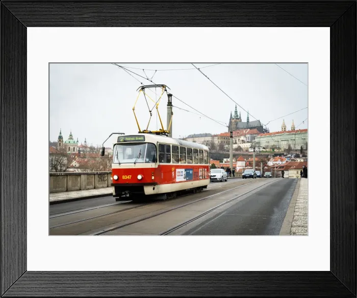 Framed Print : A traditional red tram crosses Manesuv most (bridge) with St Framed Print : A traditional red tram crosses Manesuv most (bridge) with St