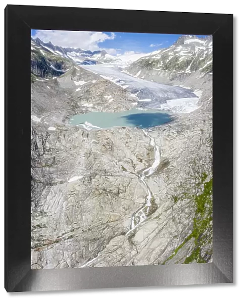 Aerial panoramic of Rhone Glacier and glacial lake at its base, Gletsch, Canton of Valais