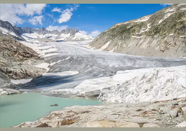 Glacial lake and Rhone Glacier partially protected by blankets to slow melting, Gletsch
