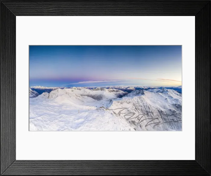 Framed Print : Pano by drone of sunrise over the narrow bends of Stelvio Pass mountain road covered Framed Print : Pano by drone of sunrise over the narrow bends of Stelvio Pass mountain road covered