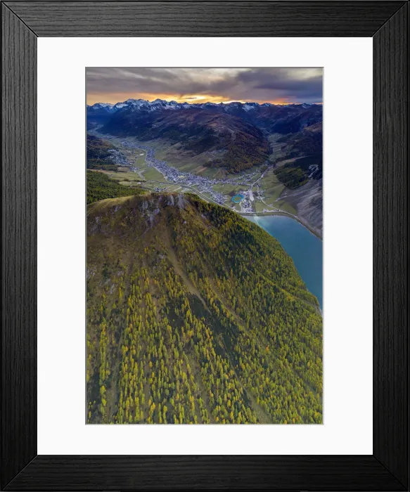 Framed Print : Sunset over larch woods on Crap de La Pare ridge towards Livigno village and lake Framed Print : Sunset over larch woods on Crap de La Pare ridge towards Livigno village and lake