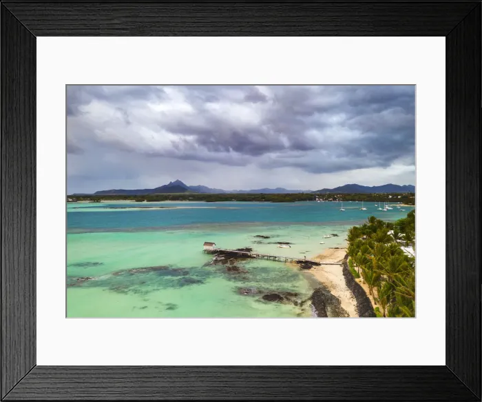 Framed Print : Clouds over lagoon and pier by a palm fringed beach, aerial view, Trou d Eau Douce Framed Print : Clouds over lagoon and pier by a palm fringed beach, aerial view, Trou d Eau Douce