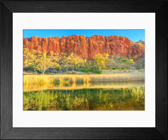 Framed Print : Scenic red sandstone wall and bush vegetation reflected in waterhole, Glen Helen Gorge Framed Print : Scenic red sandstone wall and bush vegetation reflected in waterhole, Glen Helen Gorge