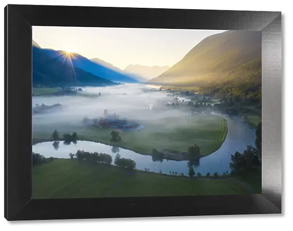 Mist over the cultivated fields along Stryneelva river, aerial view, Stryn, Nordfjorden
