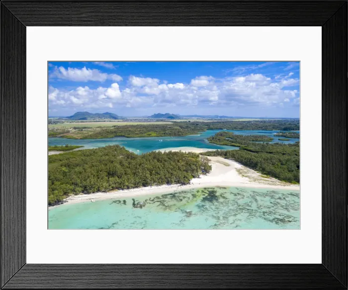 Framed Print : Aerial by drone of white sand beach with turquoise sea surrounded by tropical trees Framed Print : Aerial by drone of white sand beach with turquoise sea surrounded by tropical trees