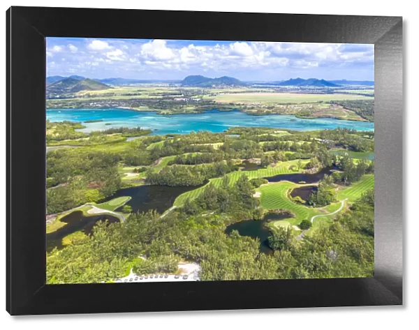 Aerial by drone of golf courses in the lush vegetation of the tropical lagoon, Ile