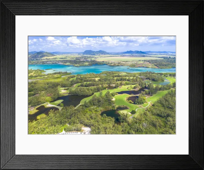 Framed Print : Aerial by drone of golf courses in the lush vegetation of the tropical lagoon, Ile Framed Print : Aerial by drone of golf courses in the lush vegetation of the tropical lagoon, Ile