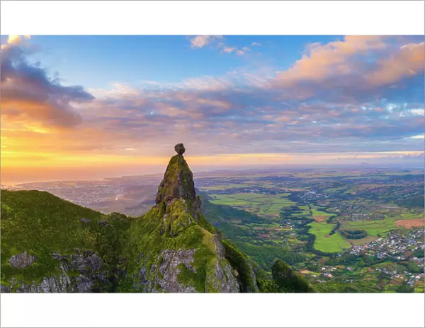 Panoramic of Le Pouce mountain and Pieter Both towards the Indian Ocean sunset, aerial