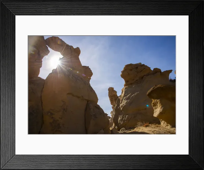 Framed Print : Sandstone sculptures and sun flare in Bisti / De-Na-Zin Wilderness in New Mexico Framed Print : Sandstone sculptures and sun flare in Bisti / De-Na-Zin Wilderness in New Mexico