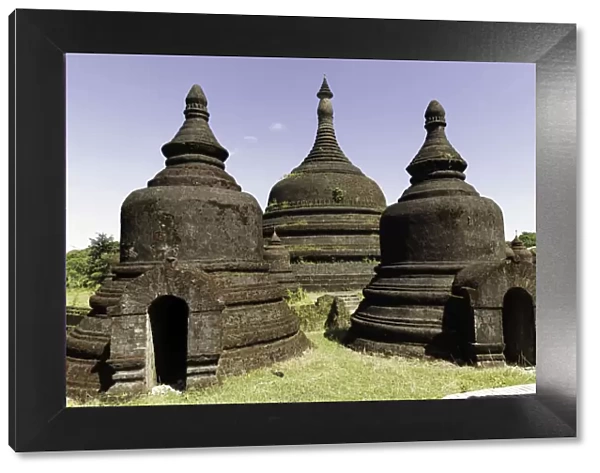 Three stupas of Ratanabon temple with clear blue sky behind, Mrauk U, Rakhine