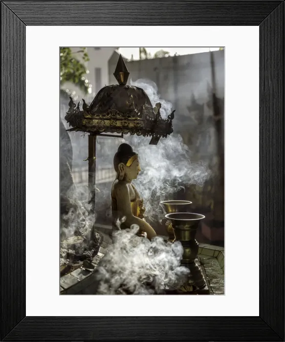 Framed Print : A small Buddha statue at Sule pagoda, surrounded by clouds of smoke with two Kinaree Framed Print : A small Buddha statue at Sule pagoda, surrounded by clouds of smoke with two Kinaree