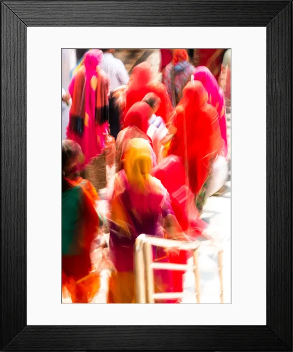 Framed Print : Brightly coloured saris (clothing) and veils, blurred in motion for effect Framed Print : Brightly coloured saris (clothing) and veils, blurred in motion for effect