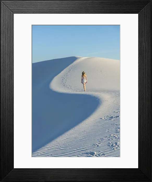 Framed Print : A woman walking along thes curve of a dunes ridge in White Sands National Park Framed Print : A woman walking along thes curve of a dunes ridge in White Sands National Park