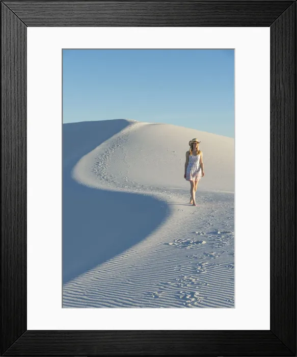 Framed Print : A woman walking along thes curve of a dunes ridge in White Sands National Park Framed Print : A woman walking along thes curve of a dunes ridge in White Sands National Park