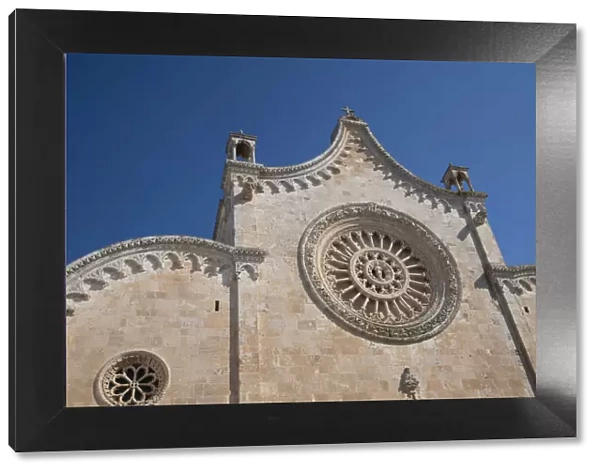 The rose window on the Cathedral of Santa Maria dell Assunzione in Ostuni, Puglia, Italy