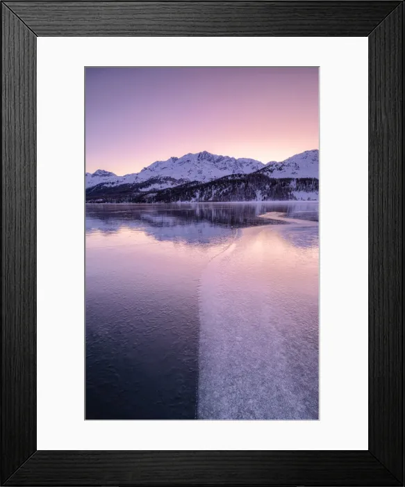 Framed Print : Colors of sunrise is reflected on the icy surface of Lake Sils, Engadine Valley