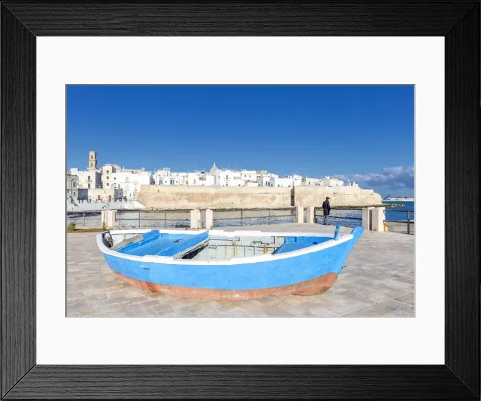 Framed Print : Old boat with the Italian old town in the background, Monopoli, Apulia, Italy, Europe Framed Print : Old boat with the Italian old town in the background, Monopoli, Apulia, Italy, Europe
