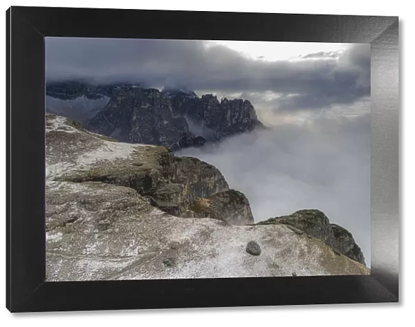 Croda dei Toni mountain and Auronzo Valley in a sea of clouds, Sesto Dolomites