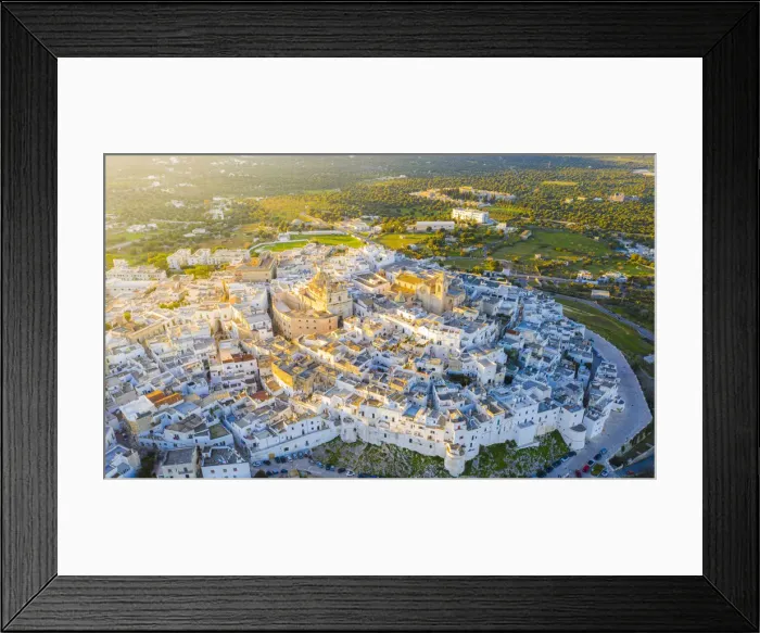Framed Print : Aerial view by drone of the old town of Ostuni at sunset, Apulia, Italy, Europe Framed Print : Aerial view by drone of the old town of Ostuni at sunset, Apulia, Italy, Europe