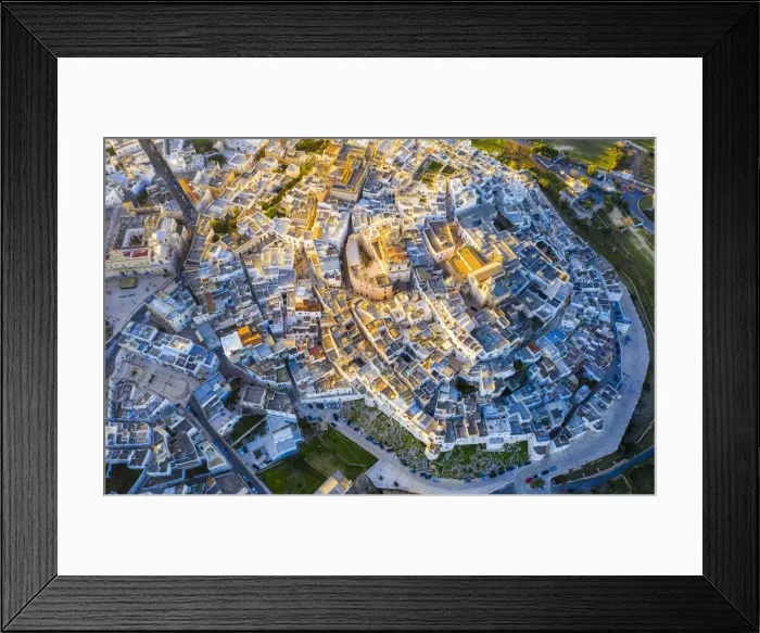 Framed Print : Zenithal aerial view of the old town of Ostuni at sunset, Apulia, Italy, Europe Framed Print : Zenithal aerial view of the old town of Ostuni at sunset, Apulia, Italy, Europe