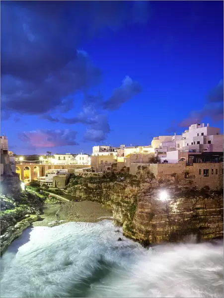 Waves crash on the beach during a winter storm, Polignano a Mare, Apulia, Italy, Europe