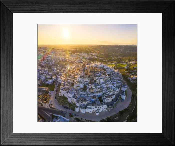 Framed Print : Aerial view by drone of the old town of Ostuni at sunset, Apulia, Italy, Europe Framed Print : Aerial view by drone of the old town of Ostuni at sunset, Apulia, Italy, Europe