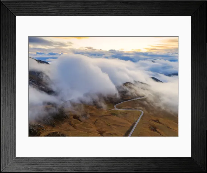 Framed Print : Aerial view by drone of fog over scenic road crossing Giau Pass in a sea of clouds Framed Print : Aerial view by drone of fog over scenic road crossing Giau Pass in a sea of clouds