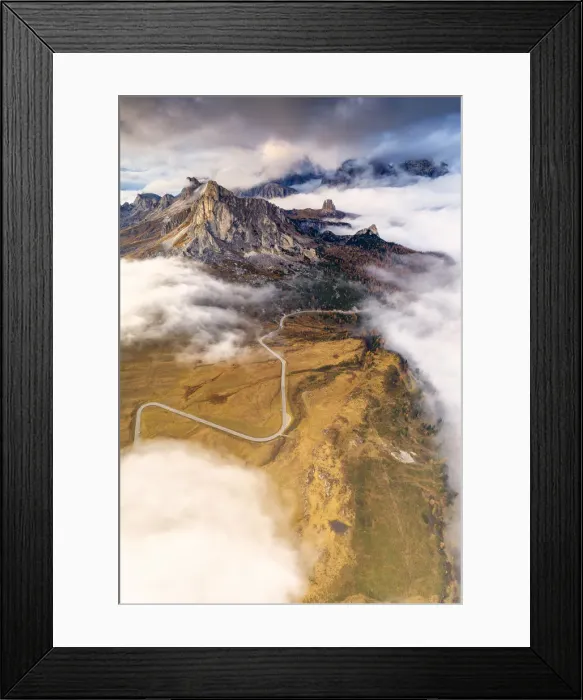 Framed Print : Aerial view by drone of Giau Pass, Ra Gusela and Cinque Torri in the mist of autumn Framed Print : Aerial view by drone of Giau Pass, Ra Gusela and Cinque Torri in the mist of autumn
