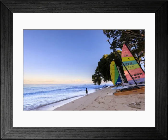 Framed Print : Paynes Bay at sunrise, lady exercises on beach, colourful sail boats Framed Print : Paynes Bay at sunrise, lady exercises on beach, colourful sail boats