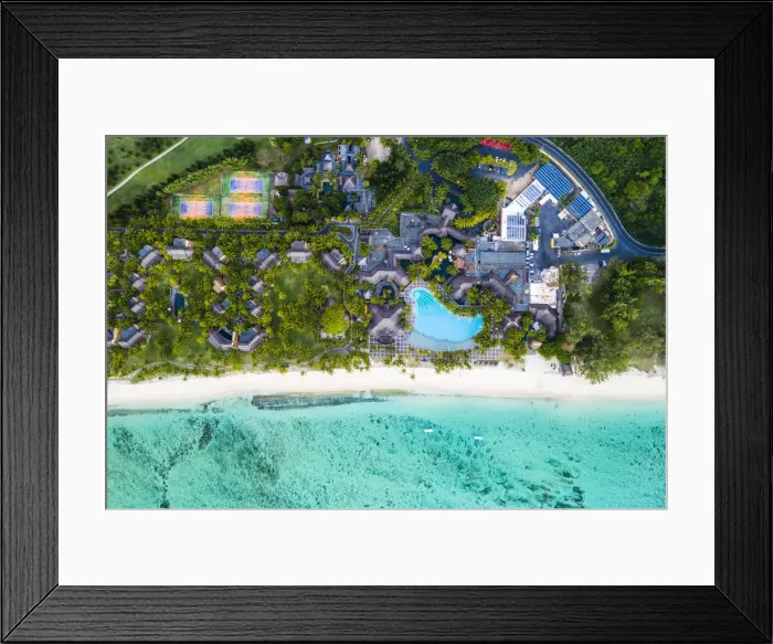 Framed Print : Aerial view by drone of luxury tourist resort on palm-fringed beach facing the tropical Framed Print : Aerial view by drone of luxury tourist resort on palm-fringed beach facing the tropical