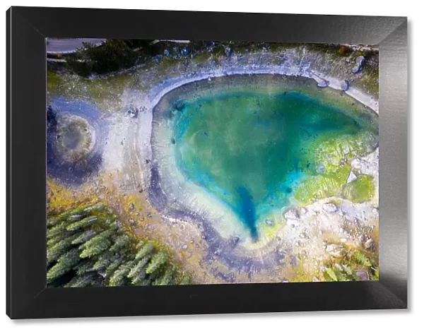 Aerial view by drone of heart shaped Carezza Lake, Dolomites, South Tyrol, Italy, Europe