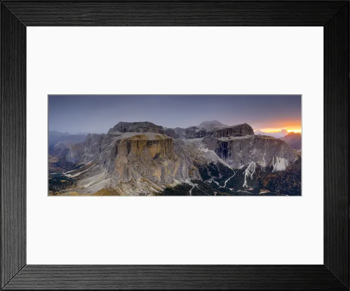 Framed Print : Woods in autumn at foot of Sass Pordoi and Sella mountain at dawn, aerial view Framed Print : Woods in autumn at foot of Sass Pordoi and Sella mountain at dawn, aerial view
