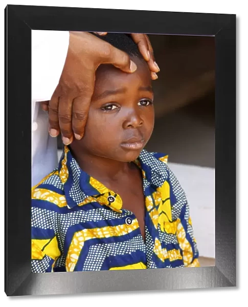African child blessed by a priest, Lome, Togo, West Africa, Africa