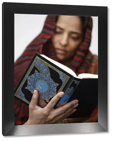 Woman reading Koran, Jordan, Middle East