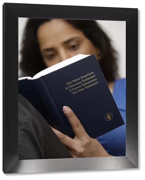 Woman reading a Bible, Jordan, Middle East