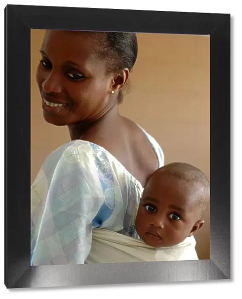 Mother carrying her baby on her back, Dakar, Senegal, West Africa, Africa
