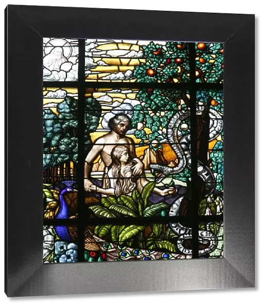 Stained glass of Adam and Eve in the Garden of Eden, Vienna, Austria, Europe