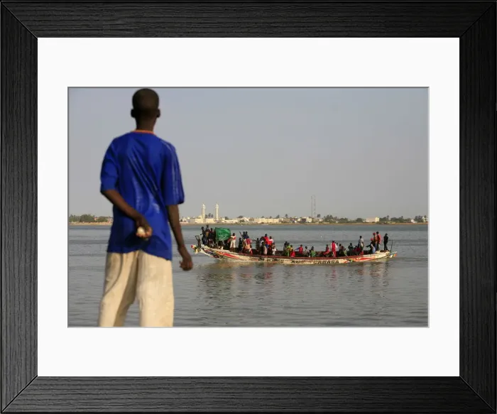 Framed Print : Boy looking at a boat, Saint Louis, Senegal, West Africa, Africa Framed Print : Boy looking at a boat, Saint Louis, Senegal, West Africa, Africa