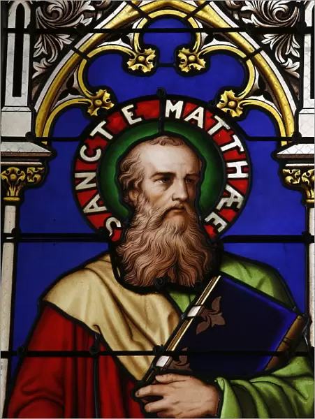 Stained glass window of St. Matthew at Collegiale Notre-Dame des Marais