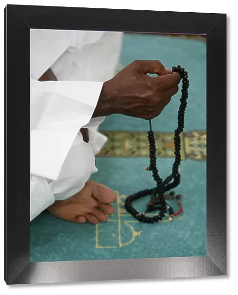 Muslim with prayer beads, Lyon, Rhone Alpes, France, Europe