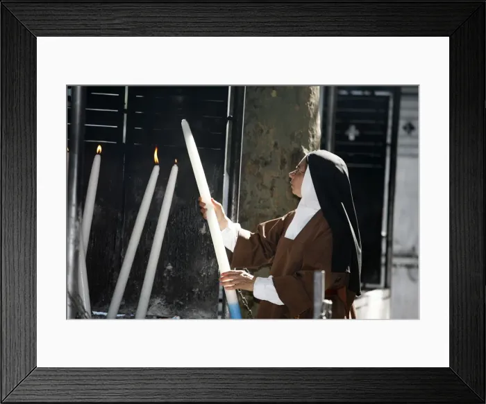 Framed Print : Nun lighting a candle at the Lourdes shrine, Lourdes, Hautes Pyrenees, France, Europe Framed Print : Nun lighting a candle at the Lourdes shrine, Lourdes, Hautes Pyrenees, France, Europe